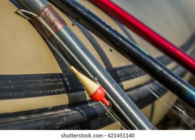 fishing tackle on the rubber boat at shore - Shutterstock ID 421451140