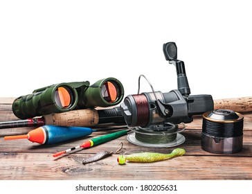 fishing tackle on the table isolated on white background