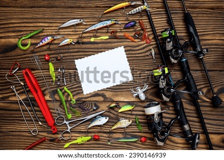 Fishing tackle on a wooden background. Fisherman Gear for catching Fish. 
