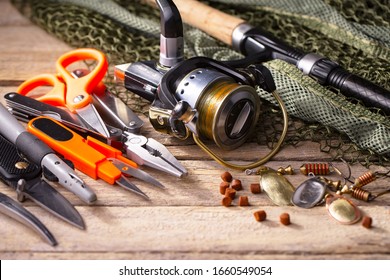 fishing tackle on a wooden table.