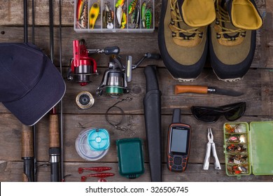 fishing tackles and fishing gear on tinber boards look on top
