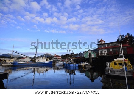 Fishing town. The harbour front of Prince Rupert from a boat coming back into the marina. A perfect calm day with scattered cloud and vibrant colours
