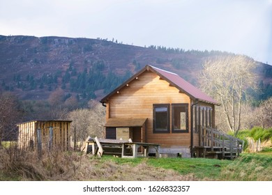 Fishing Wooden Shelter Hut And Log Store On River Dee Scotland For Fisherman And Anglers