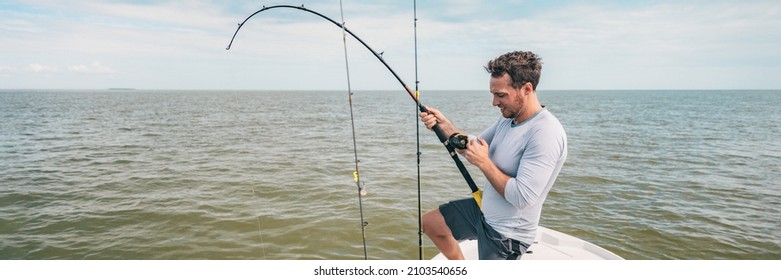 Fishing young man with sport fish rod and reel line for recreation on summer ocean day. Recreational fishing fisherman outdoor leisure lifestyle.