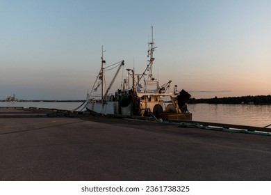 Fishingboat at its berth in the sunset an calm and beautiful summer evening.