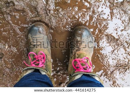 Fishing/walking boots in a muddy area