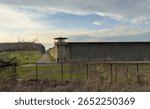 Fishkill Correctional Facility multi-security level prison in New York, United States wither guard tower at sunset (jail, prisoner, prisoners, crime)