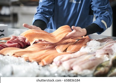 Fishmonger selling fish