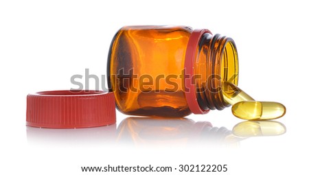 Fishoil pills out of bottle on white background