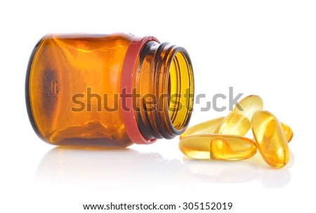 Fishoil pills out of bottle on white background