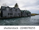 Fishtown in Leland, Michigan.  Fishing-shanty type buildings along a channel.