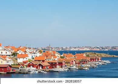 Fiskebackskil An Old Fishing Village On The Swedish West Coast, With Lysekil City In The Background