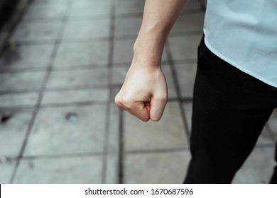A fist of angry business man, right hand. Furious fist from the businessman. - Shutterstock ID 1670687596