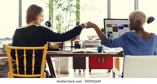 Fist Bump Corporate Colleagues Teamwork Office Concept - Shutterstock ID 502932649