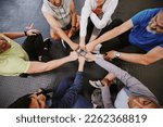 Fist bump, fitness and people n gym training group, circle and community support teamwork for workout. Exercise club, goals and lose weight challenge of friends with collaboration emoji hands above