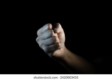 fist, Hand gesture. man clenched fist, ready to punch, isolated on black, close-up, copy space - Powered by Shutterstock