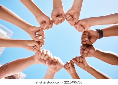 Fist Hands, Circle And Community Support Diversity People, Protest Group And Freedom Fight On Blue Sky Background. Below Solidarity, Teamwork And Motivation For Justice Goal, Trust And Society Power