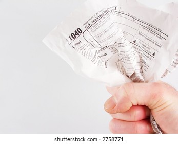 Fist Holding Crumpled Tax Form