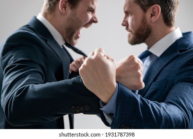 fist of punching disagreed men business partners or colleague disputing and fighting aggressive and angry while conflict, selective focus, corporate battle.