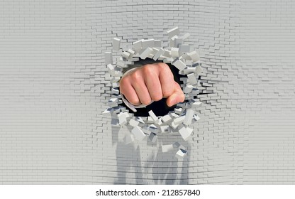 Fist punching through a brick wall