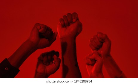 Fists on raised hands of multiracial people on red background, widescreen. Stop racism concept - Shutterstock ID 1943208934