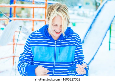 Fit Active Old Blond Woman Performing Training And Doing Her Warming Up Exercise With Jumping Rope Outdoors Snowy Winter