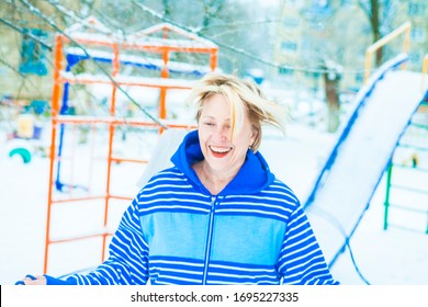 Fit Active Old Blond Woman Performing Training And Doing Her Warming Up Exercise With Jumping Rope Outdoors Snowy Winter