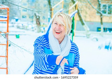 Fit Active Old Blond Woman Performing Training And Doing Her Warming Up Exercise With Jumping Rope Outdoors Snowy Winter