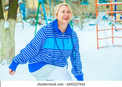 Fit Active Old Blond Woman Performing Training And Doing Her Warming Up Exercise With Jumping Rope Outdoors Snowy Winter