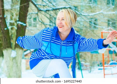 Fit Active Old Blond Woman Performing Training And Doing Her Warming Up Exercise With Jumping Rope Outdoors Snowy Winter