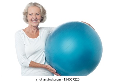 Fit Aged Woman Holding Big Blue Exercise Ball