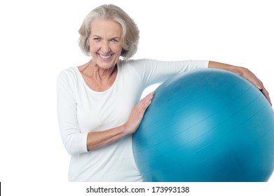 Fit Aged Woman Holding Big Blue Exercise Ball