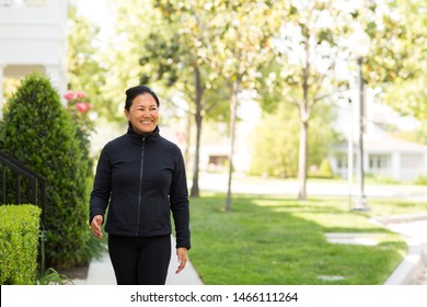 Fit Asian Woman Exercising And Walking Outside