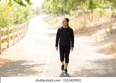 Fit Asian Woman Exercising And Walking Outside