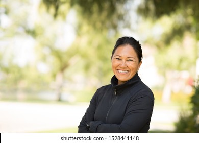 Fit Asian Woman Exercising And Walking Outside