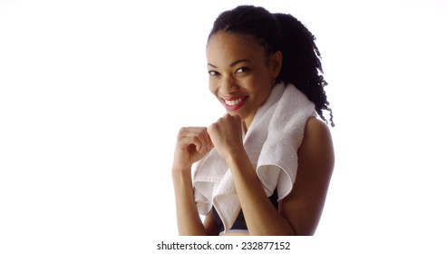 Fit Black woman throwing punches at camera - Powered by Shutterstock