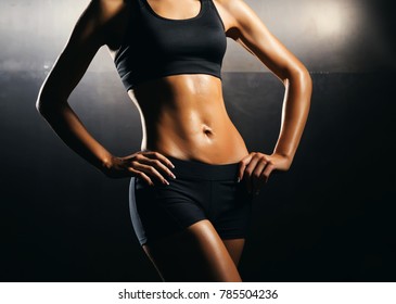 Fit body of beautiful, healthy and sporty girl. Slim woman posing in sportswear. - Shutterstock ID 785504236