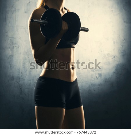 Similar – Rear view portrait of one young middle age athletic woman at crossfit training, exercising with trx suspension fitness straps over dark background