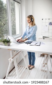 Fit Businesswoman Working At Ergonomic Standing Desk