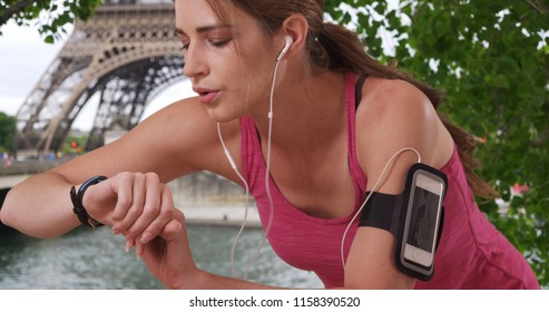 Fit Caucasian Woman Checks Watch After Heavy Jog In Paris France