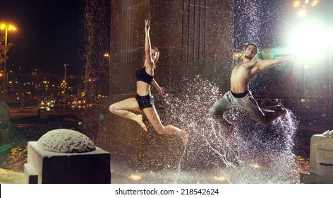 Fit couple in the city at night - Powered by Shutterstock