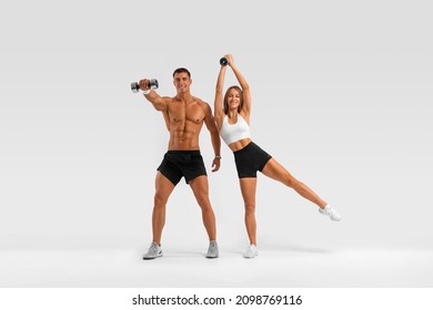 Fit couple at the gym isolated on white background. Fitness concept. Healthy life style.