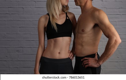 Fit couple, strong muscular man and thin woman . Sport, fitness ,workout concept.