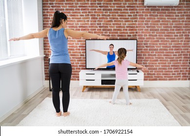 Fit Family Doing Home Online Yoga Fitness Exercise