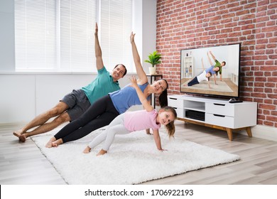 Fit Family Doing Home Online Fitness Plank Exercise