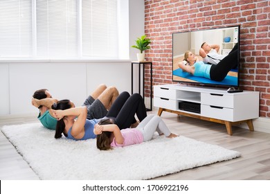 Fit Family Doing Home Online Fitness Exercise