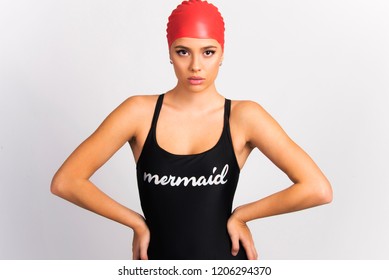 fit girl young woman with red swimming hat wearing swimming suit, isolated on white - Powered by Shutterstock