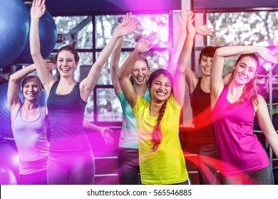 Fit Group Dancing And Smiling In Gym