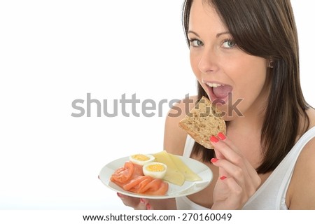 Fit Happy Young Brunette Caucasian Woman, Holding A Plate Of A Typical Scandinavian Style Low Fat And Healthy Breakfast, Alone And Isolated On White, Smoked Salmon, Boiled Eggs, Bread And Cheese