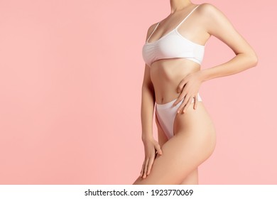 Fit And Healthy. Beautiful Female Body On Pink Background. Beauty, Cosmetics, Spa, Depilation, Diet And Treatment, Fitness Concept. Fit And Sportive, Sensual Body With Well-kept Skin In Underwear.